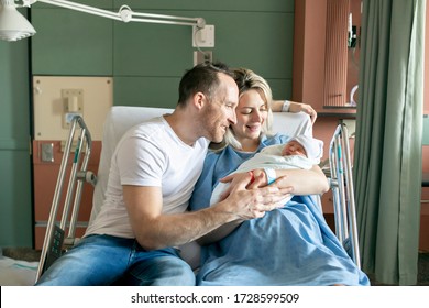 A Mother And Father With Her Newborn Baby At The Hospital A Day After A Natural Birth Labor