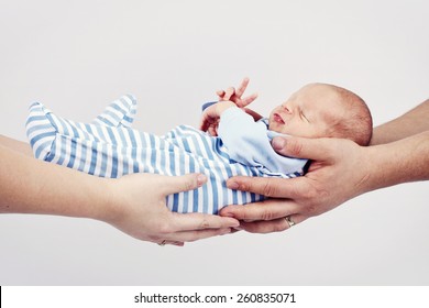 Mother And Father Holding Newborn Baby