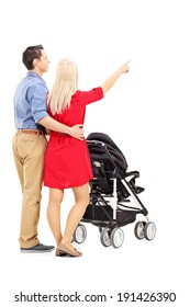 Mother And Father Pushing A Baby Stroller Isolated On White Background, Rear View