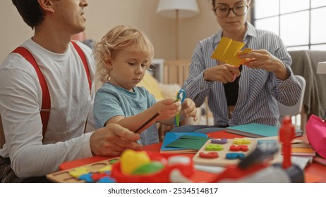 Mother, father, and son doing crafts together in a cozy indoor living room - Powered by Shutterstock