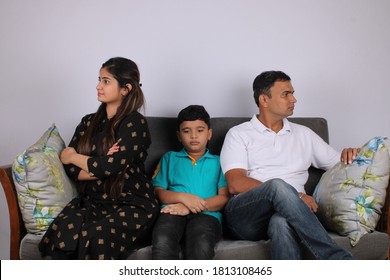 mother, father and son ignoring each other after argument. children and family conflict concept.