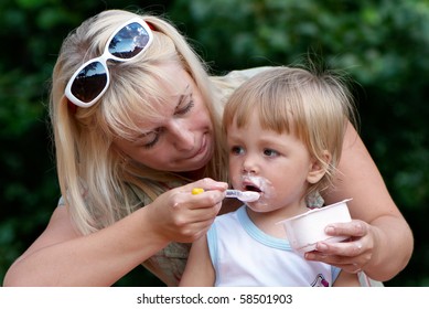 Mother and father with young son at park