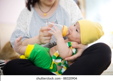 mother feed milk to baby