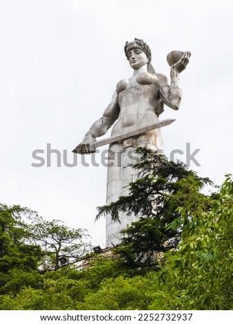 Mother Georgia or Kartlis Deda Monument in Tbilisi, Georgia. Statue with sword and bowl of wine is symbol for fight and hospitality. Memorial stands on Sololaki hill and overlooks old town of Tiflis