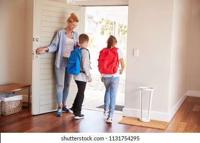 Mother Getting Children Ready To Leave House For School - Powered by Shutterstock