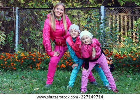 mother with the girls in pink costumes