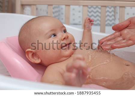 Similar – Newborn in the bathtub