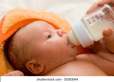 Mother Give Drink Her Baby Boy By Feeding Bottle