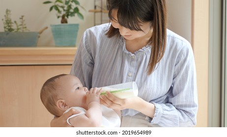 Mother Gives Milk To Her Baby