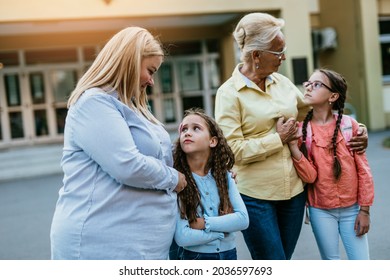 Mother And Grandmother Came To Pick Up Children At School.