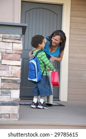 Mother greets child returning from school - Shutterstock ID 29785615
