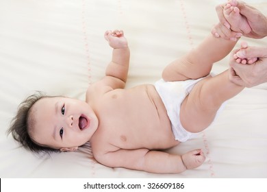Mother hand Massaging for  baby smile