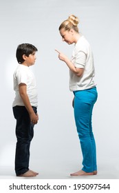 Mother having argument with her kid showing finger for discipline and punishment full body shot