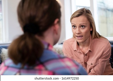 Mother Having Serious Conversation With Young Daughter At Home