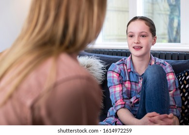 Mother Having Serious Conversation With Young Daughter At Home