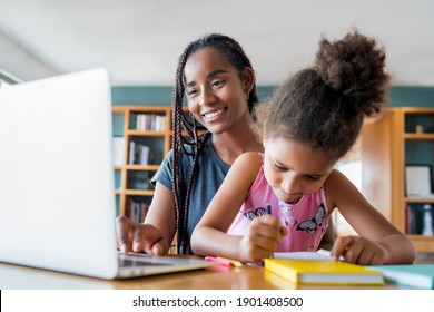 A Mother Helping Her Daughter With Homeschool.