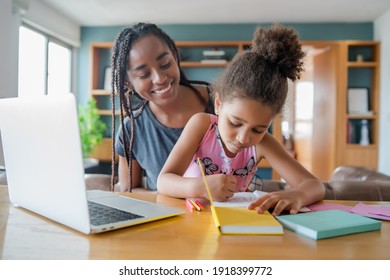 A Mother Helping Her Daughter With Homeschool.