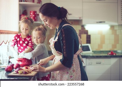 Mother With Her 5 Years Old Kids Cooking Holiday Pie In The Kitchen To Mothers Day, Casual Lifestyle Photo Series In Real Life Interior