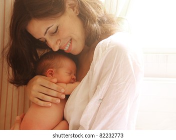 mother with her baby - Powered by Shutterstock