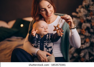 Mother With Her Baby Boy Celebrating Christmas