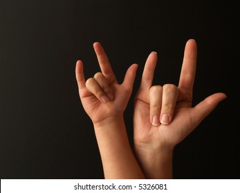 A Mother And Her Child Doing Sign Language For I LOVE YOU