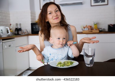 Mother with her child eating together and have a fun