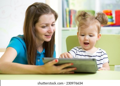 mother and her child with tablet pc