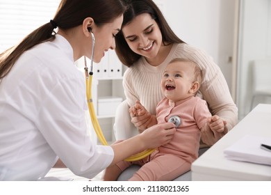 Mother with her cute baby visiting pediatrician in clinic - Powered by Shutterstock