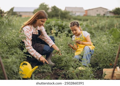 A mother and her daughter enjoy quality time together gardening in their vegetable garden, nurturing plants and strengthening family bonds on a sunny day. - Powered by Shutterstock