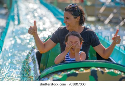 Mother and her daughter having fun in waterpark