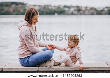 Mother with her little child in park