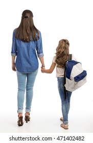 Mother And Her Little Daughter Walking Together Going To The School