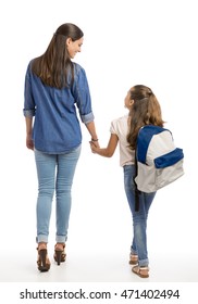 Mother And Her Little Daughter Walking Together Going To The School