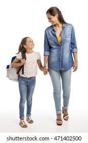 Mother And Her Little Daughter Walking Together Going To The School