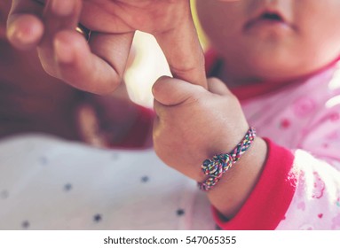 Mother With Her Newborn Baby Care Hands