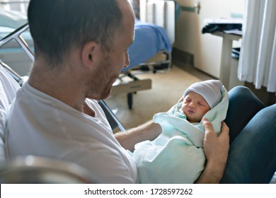 A Mother with her newborn baby at the hospital a day after a natural birth labor - Powered by Shutterstock