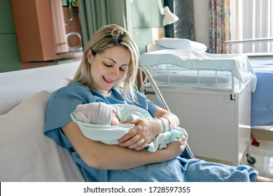 A Mother With Her Newborn Baby At The Hospital A Day After A Natural Birth Labor