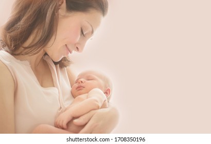 Mother and her Newborn Baby together. Love. Happy Mother and Baby kissing and hugging. Soft image of Beautiful Family. Maternity concept. Parenthood. Motherhood, adoption concept. On pink background - Shutterstock ID 1708350196