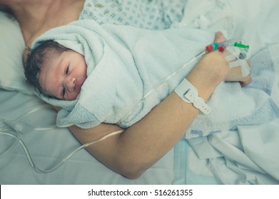 A mother with her newborn child in the hospital