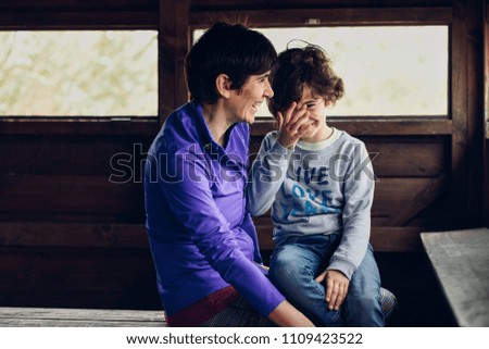 Similar – Mother with her seven year old daughter laughing in a cabin in the countryside.