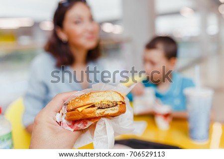 Mother And her son Having a fast food Lunch Together At The Mall