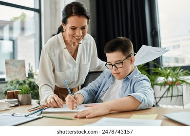 A mother and her son, who has Down syndrome, are working together in a home office, showcasing inclusivity and diversity. - Powered by Shutterstock