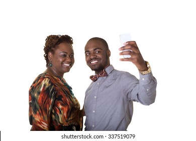 A Mother And Her Teenage Son Take A Picture Of Themselves On A Cell Phone