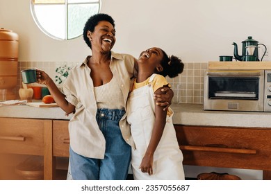 Mother and her young daughter share a loving moment in a Brazilian kitchen. Smiles and laughter fill the air as they bond over a cup of coffee, embodying the joy and warmth of family life. - Powered by Shutterstock