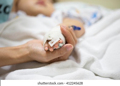 Mother Holding A Baby Hand In Hospital.