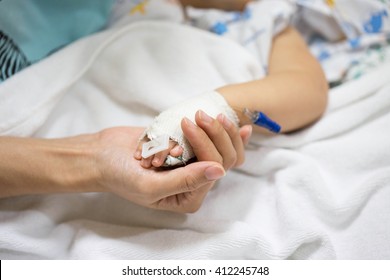 Mother Holding A Baby Hand In Hospital.