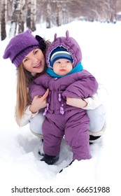 Mother Holding A Baby, Snow, Winter Park, Walk