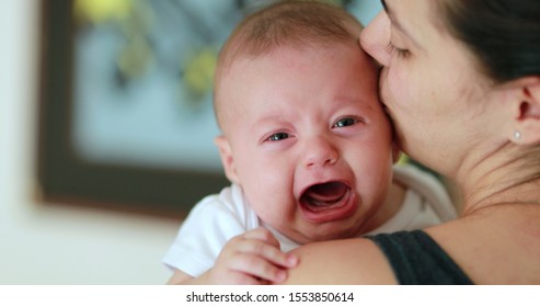 Mother Holding Calming Crying Baby Looking Stock Photo 1553850614 ...