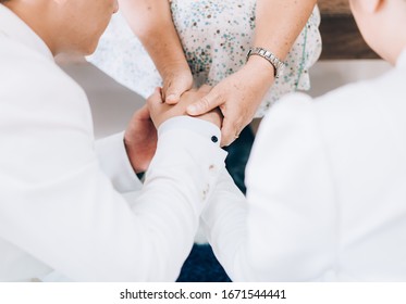 Mother Holding Hands And Praying For Married Couple.praying In Wedding Ceremony.Asian Man And Woman Hand Praying,Hands Folded In Prayer Concept For Faith, Spirituality And Religion.