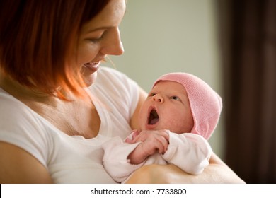 Mother Holding Newborn Baby Girl